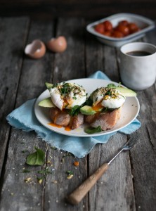 Poached eggs on toasted sourdough with avocado and dukka